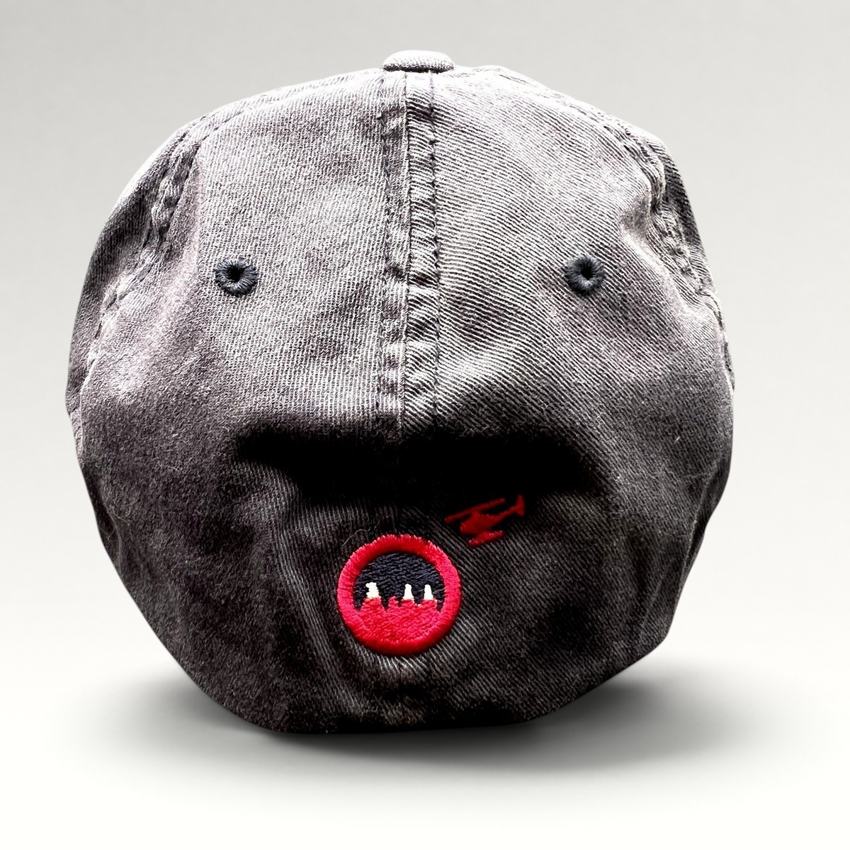 Raree Finds vintage-style black washed cotton Flexfit hat with red embroidered logo on the back