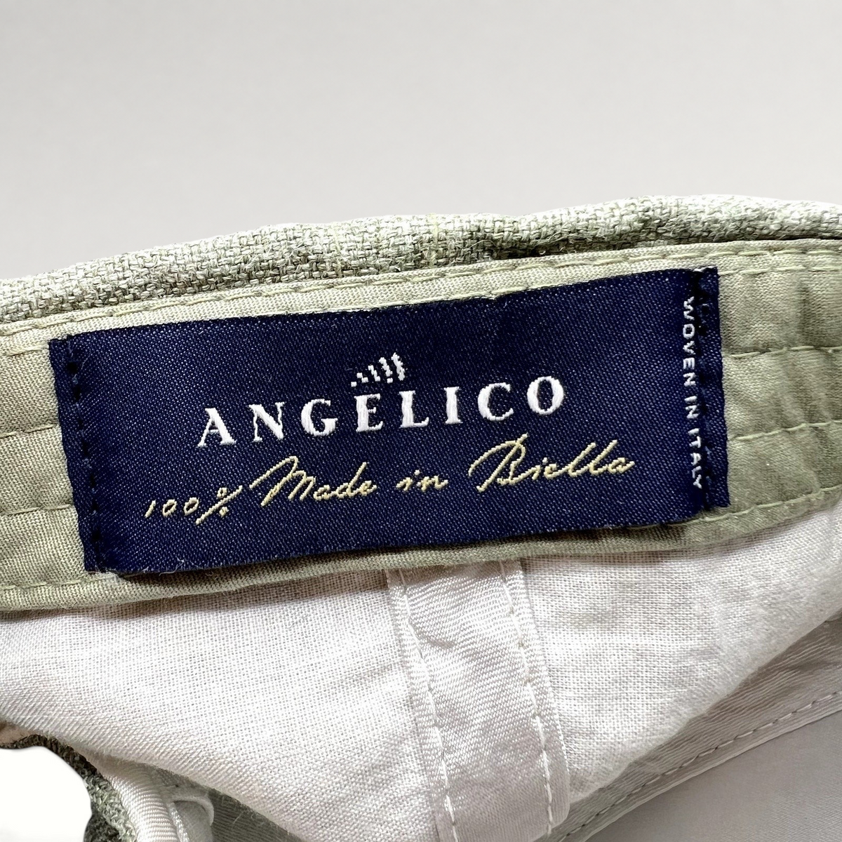 Raree Finds Angelico sage green linen cap interior label showing Made in Biella Italy craftsmanship