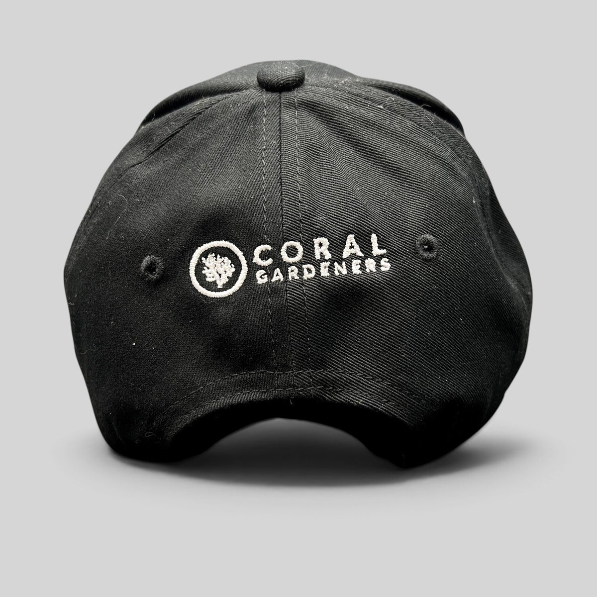Raree Finds black Coral Gardeners strapback hat with white embroidered logo on the back panel