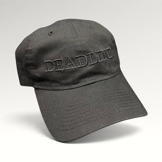 Raree Finds black New Era 9TWENTY strapback hat with tonal DEADLINE embroidery on the front and a curved brim.