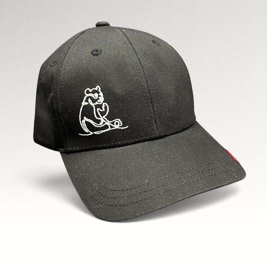 Raree Finds black strapback cap featuring a minimalist white embroidered panda graphic on the front panel.