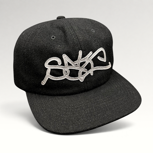 Raree Finds black Sake Brand strapback hat with oversized gray embroidered script logo and flat brim design