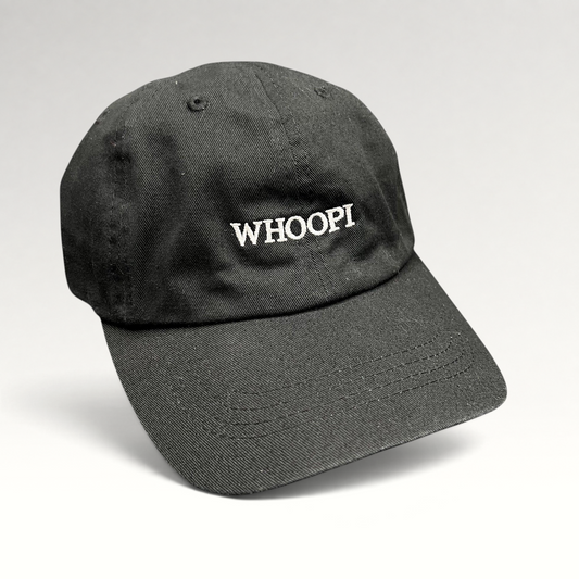 Raree Finds black organic cotton dad cap with white WHOOPI embroidery on the front and a curved brim