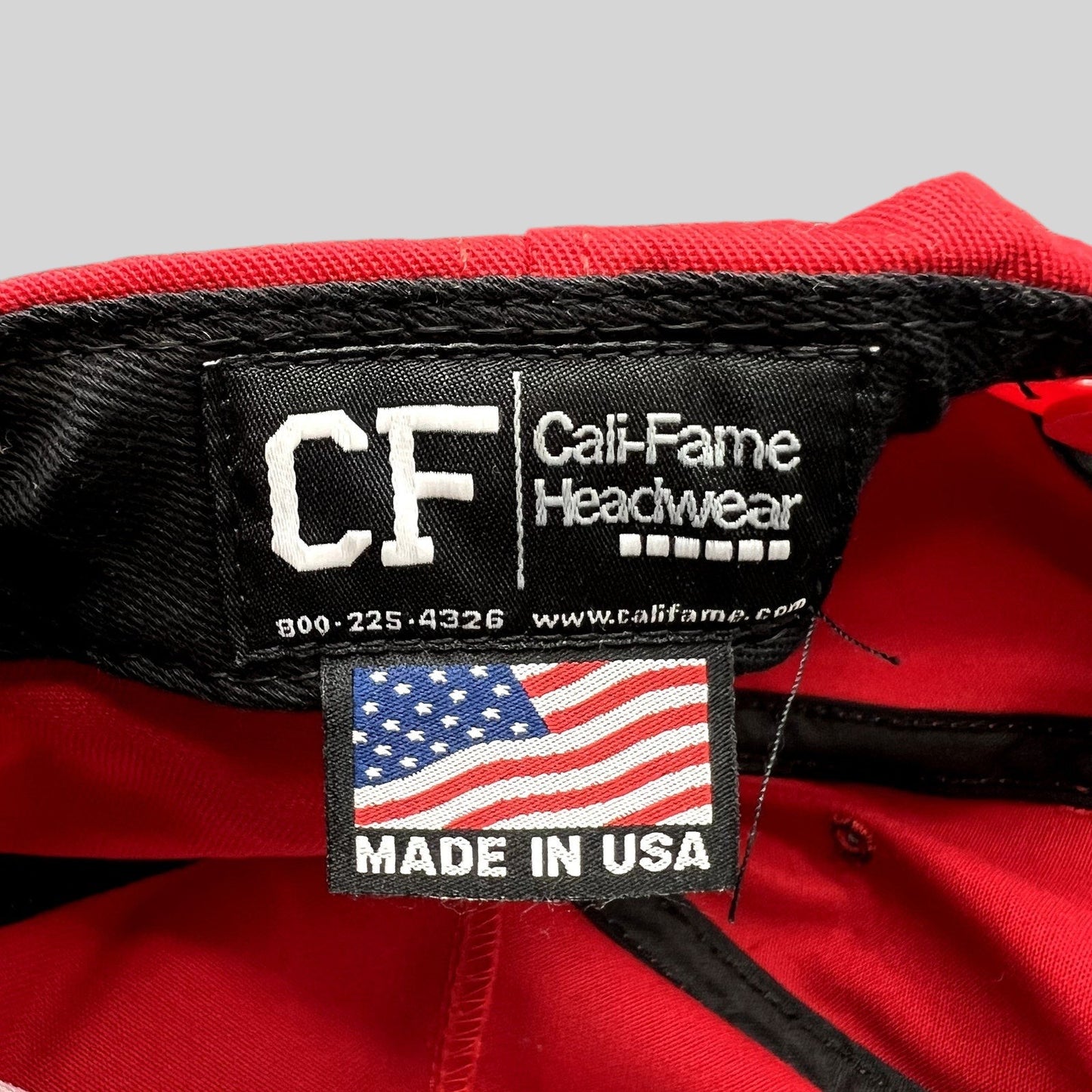 Raree Finds official Cali-Fame Headwear Made in USA tag inside a red MAGA snapback hat
