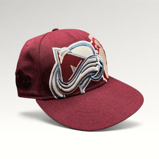 Raree Finds vintage Colorado Avalanche New Era 59FIFTY fitted hat in burgundy with oversized raised logo embroidery.