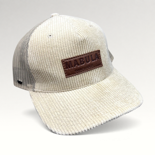 Raree Finds cream corduroy trucker hat with breathable mesh back and embossed leather Mabula Game Lodge patch