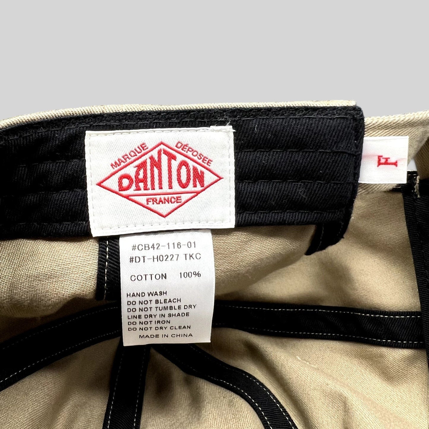 Raree Finds Danton khaki cotton twill cap interior showing brand logo label and care instructions
