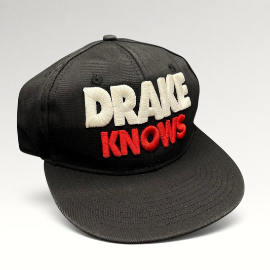 Raree Finds vintage black snapback hat with 3D white and red Drake Knows embroidery in a streetwear style