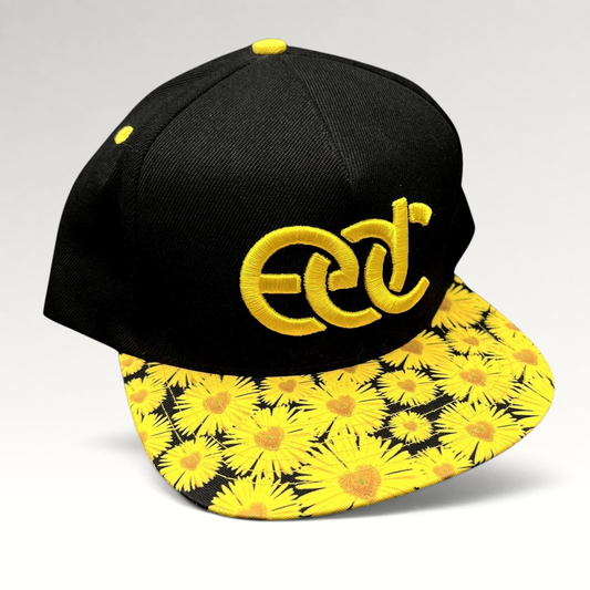 Raree Finds Insomniac EDC snapback hat with a black crown, yellow embroidered logo, and sunflower print flat brim.