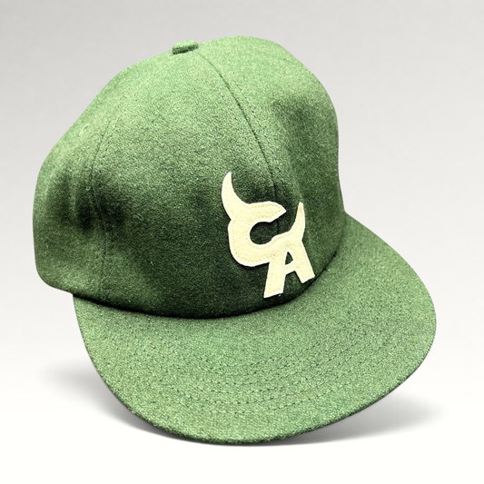 Raree Finds forest green wool-style strapback hat with cream embroidered Chromakopia logo and flat bill design.