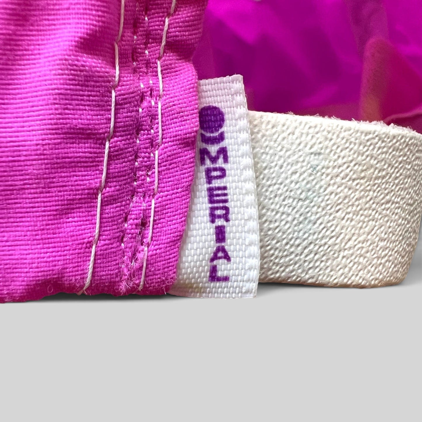 Raree Finds vintage Imperial hat interior tag showing brand logo on neon pink nylon fabric with white stitching