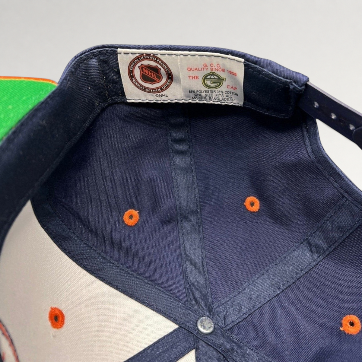 Raree Finds vintage New York Islanders snapback interior showing The G Cap brand tag and NHL licensing label
