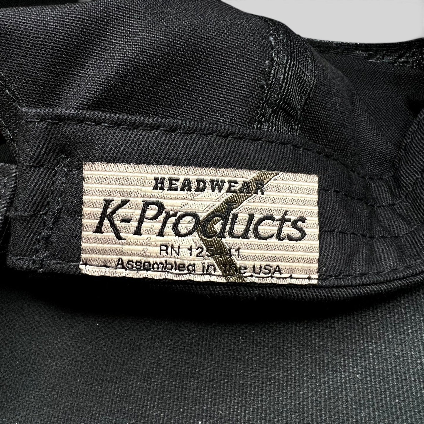 Raree Finds vintage K-Products hat interior label showing Headwear branding and Assembled in the USA text