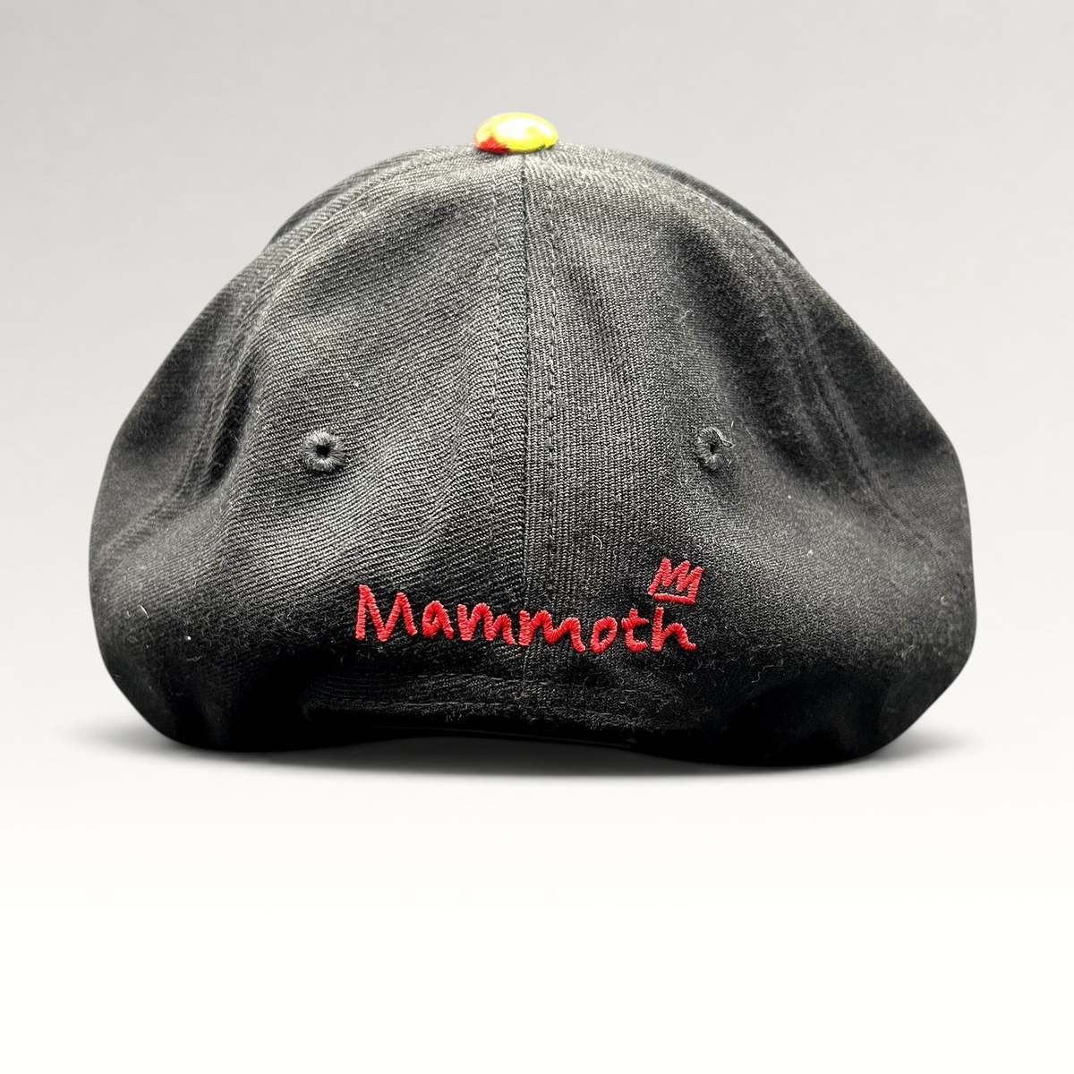 Raree Finds black snapback hat featuring a red embroidered Mammoth Mountain logo on the back and a colorful top button