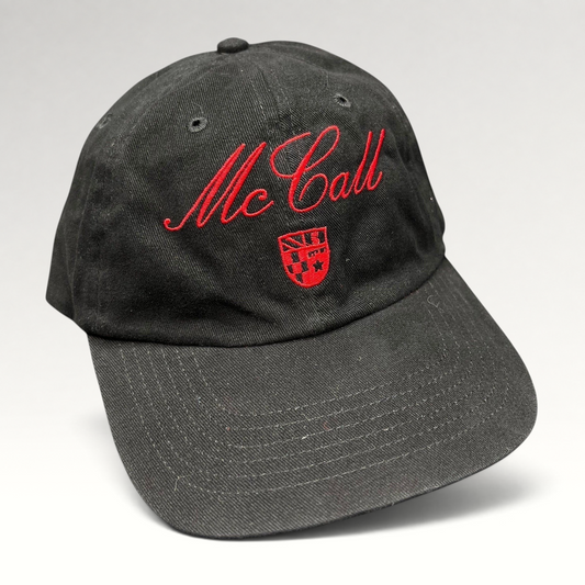 Raree Finds McCall Motor Works black strapback hat with red script embroidery and a small crest on the front crown.