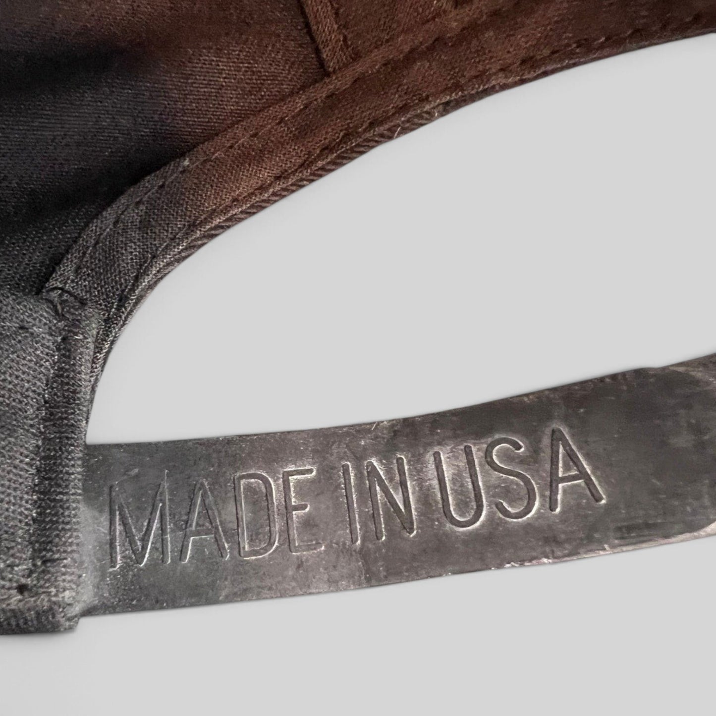 Raree Finds vintage Minnesota Vikings snapback cap showing the Made in USA embossed detail on the adjustable strap.