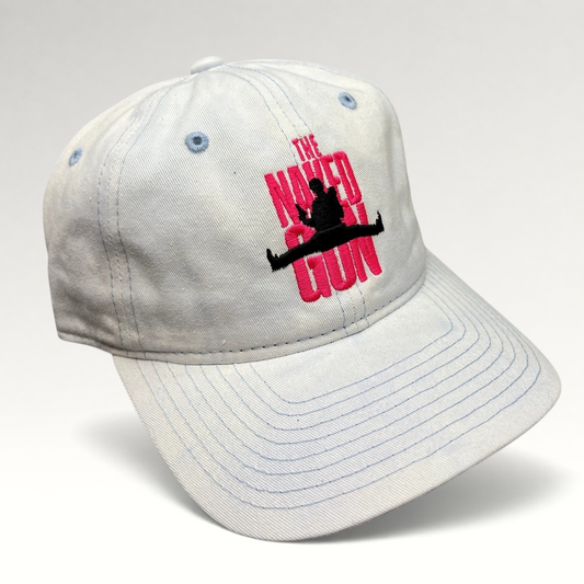 Raree Finds white cotton strapback hat with pink The Naked Gun embroidery and light blue stitching details.