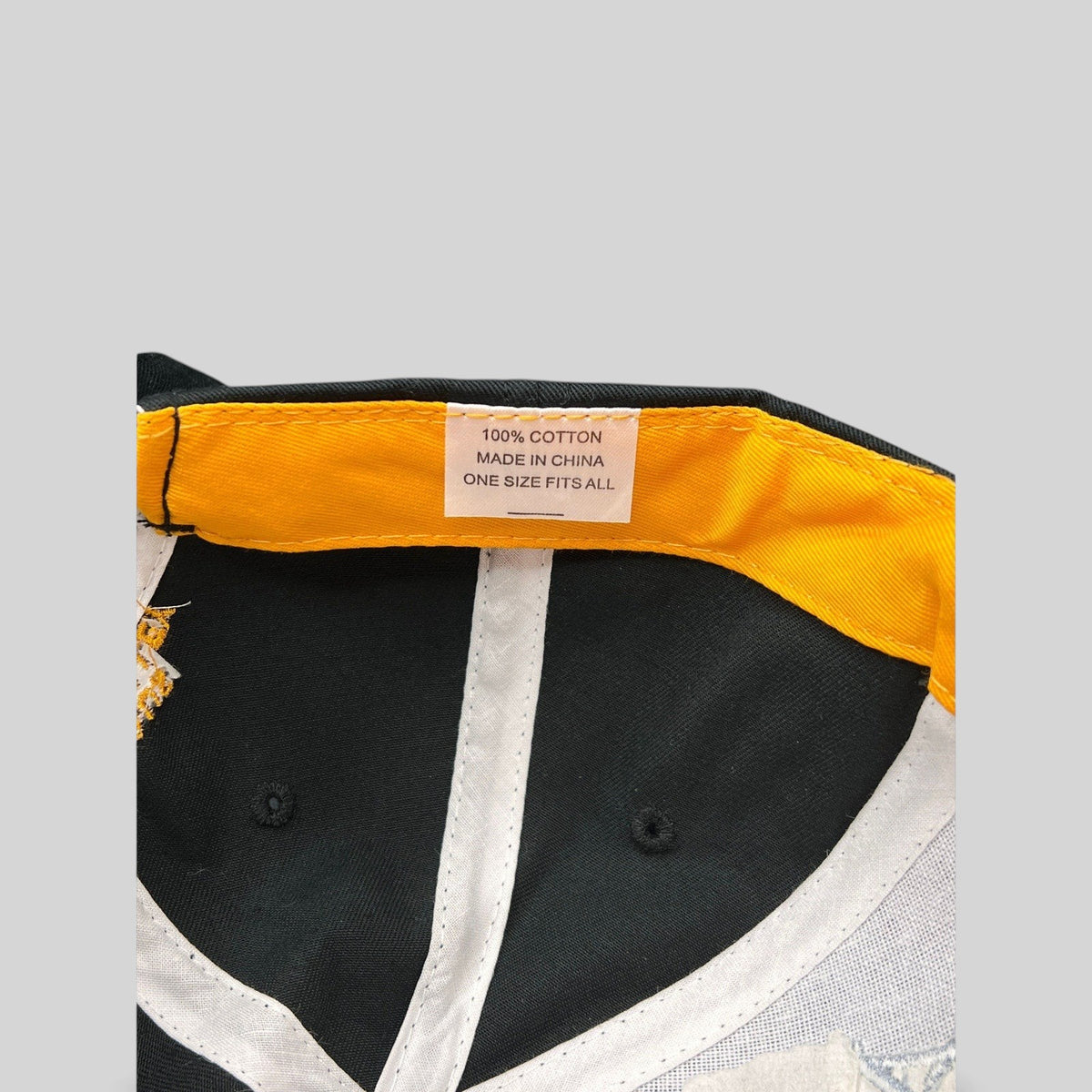 Raree Finds vintage NAPA racing hat interior showing yellow sweatband and 100 percent cotton care label