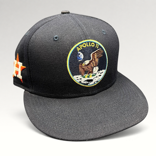 Raree Finds navy blue New Era 59FIFTY fitted hat featuring an embroidered Apollo 11 mission patch on the front.