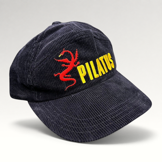 Raree Finds vintage navy corduroy strapback hat featuring yellow Pilatus text and a red dragon embroidery.