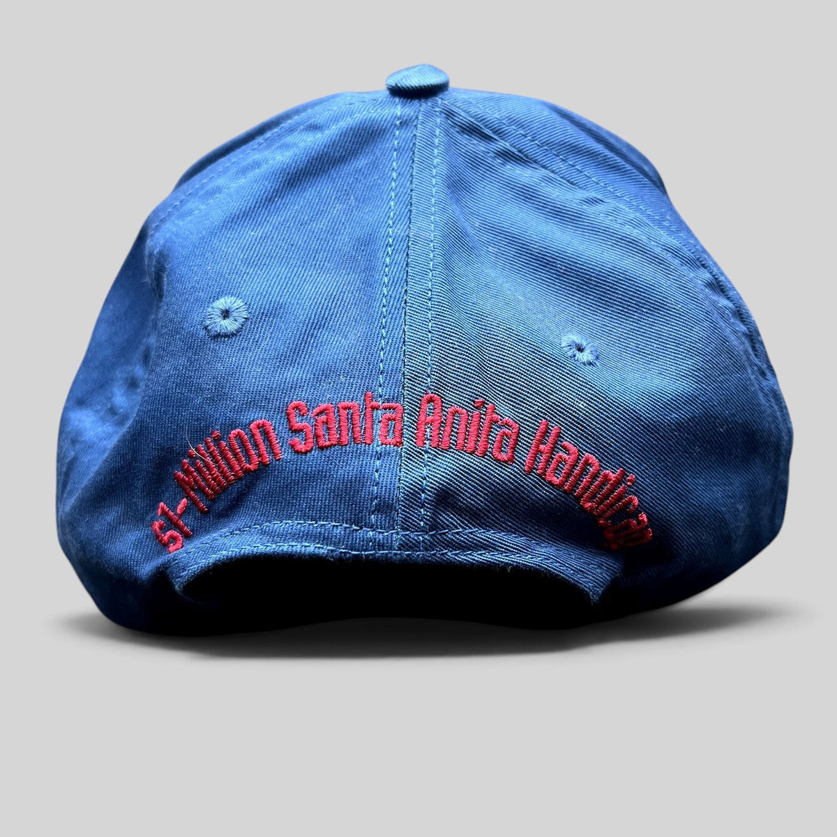 Raree Finds vintage navy snapback hat with red embroidered Santa Anita Handicap text on the back
