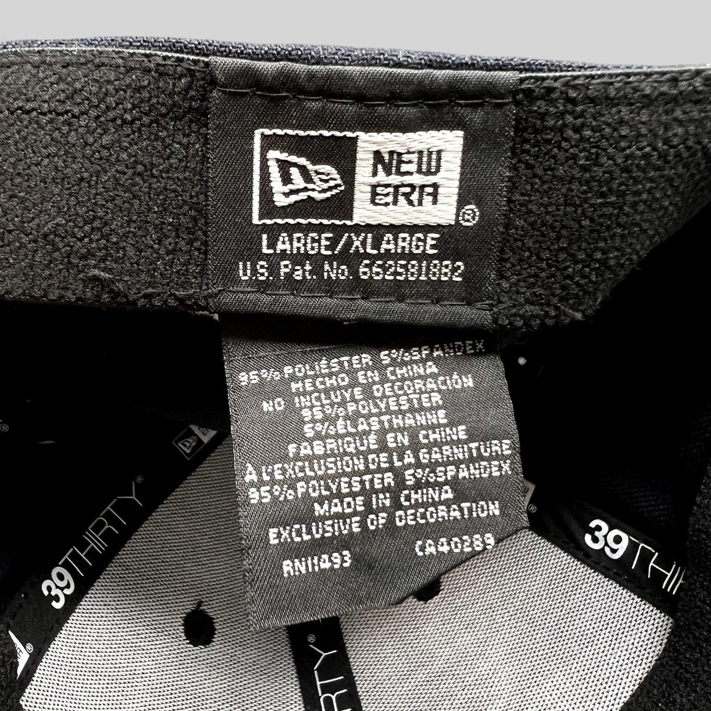 Raree Finds New Era 39THIRTY flex fit hat interior label showing size L/XL and polyester spandex material details
