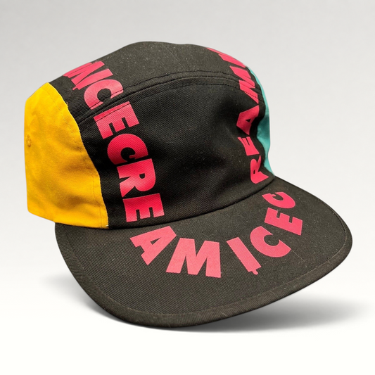 Raree Finds New Era Ice Cream America cotton strapback hat with pink graphic text, yellow and teal side panels.
