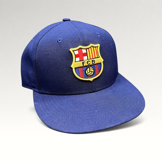 Raree Finds Nike True FC Barcelona snapback hat in navy blue with an embroidered FCB crest and flat brim.