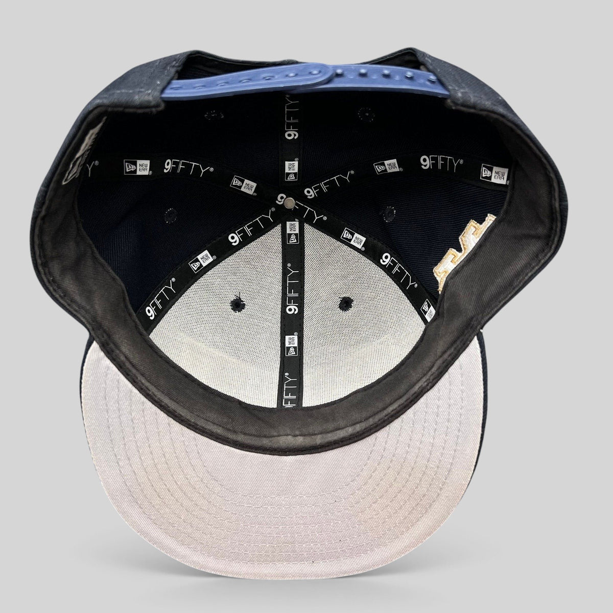 Raree Finds New Era 9FIFTY Notre Dame snapback hat interior view showing branded taping and structured crown