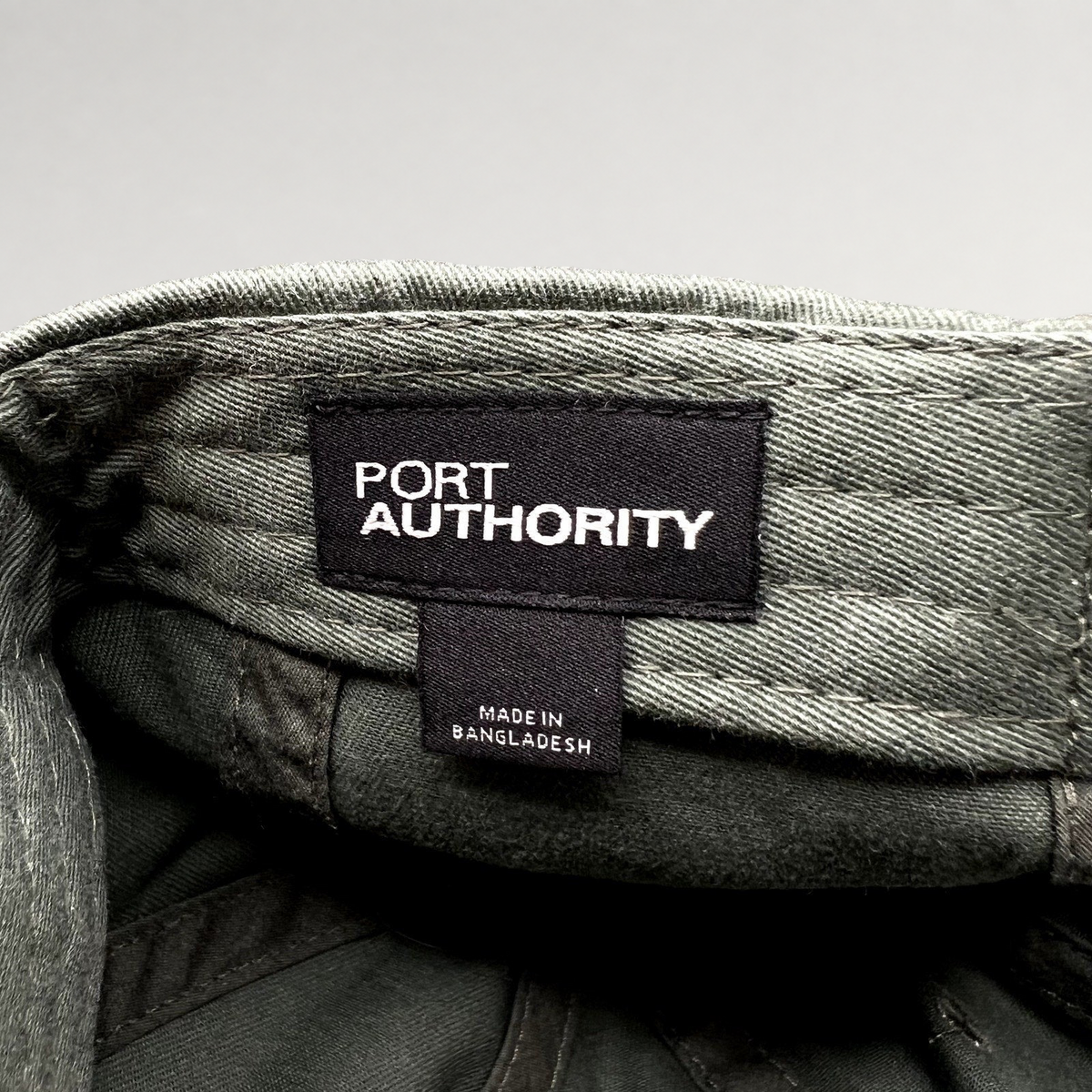 Raree Finds olive green cotton hat interior showing the Port Authority brand label and Made in Bangladesh tag