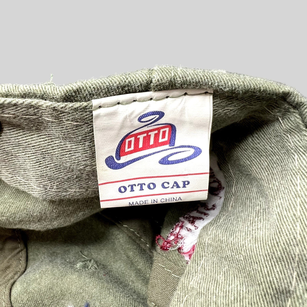 Raree Finds vintage 1999 Otto Cap label inside olive green cotton strapback hat with authentic wear