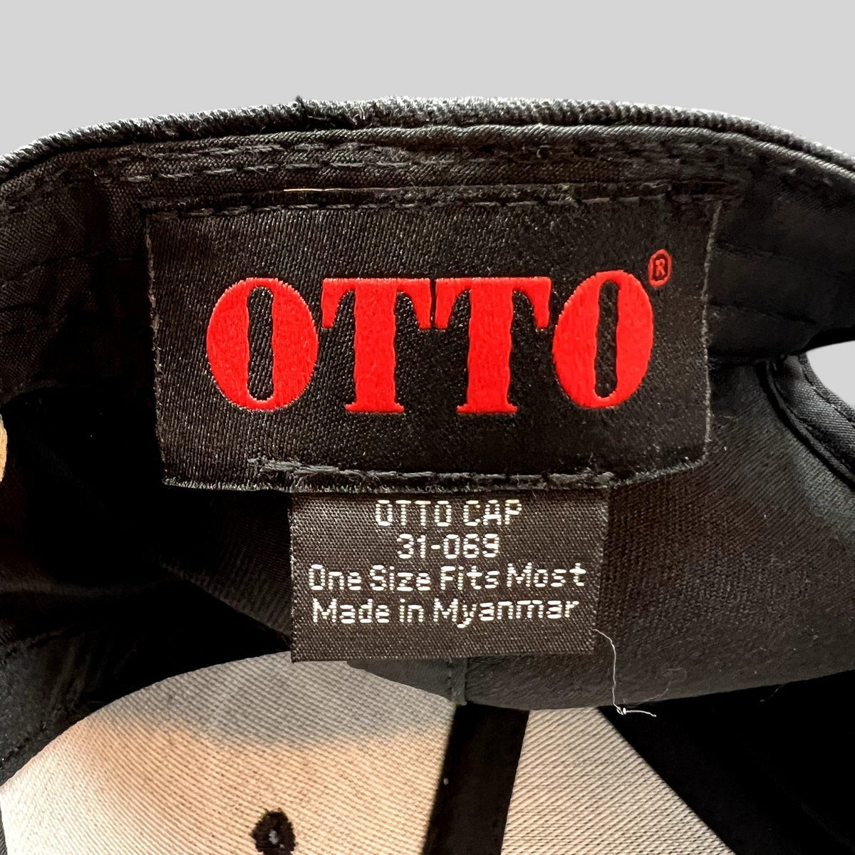 Raree Finds black OTTO cap interior label showing brand name, model number 31-069, and one size fits most details.