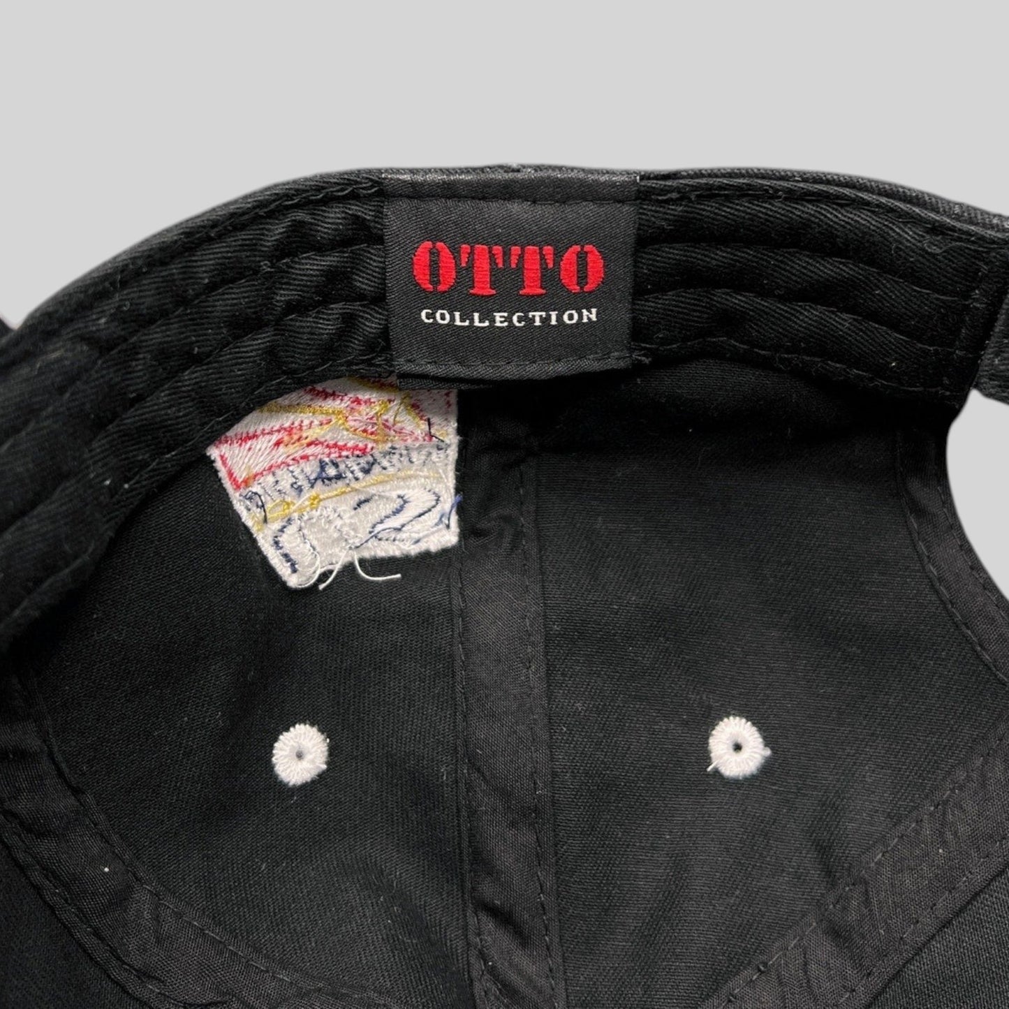 Raree Finds vintage Otto Collection black cotton hat interior showing brand label and embroidered patch detail