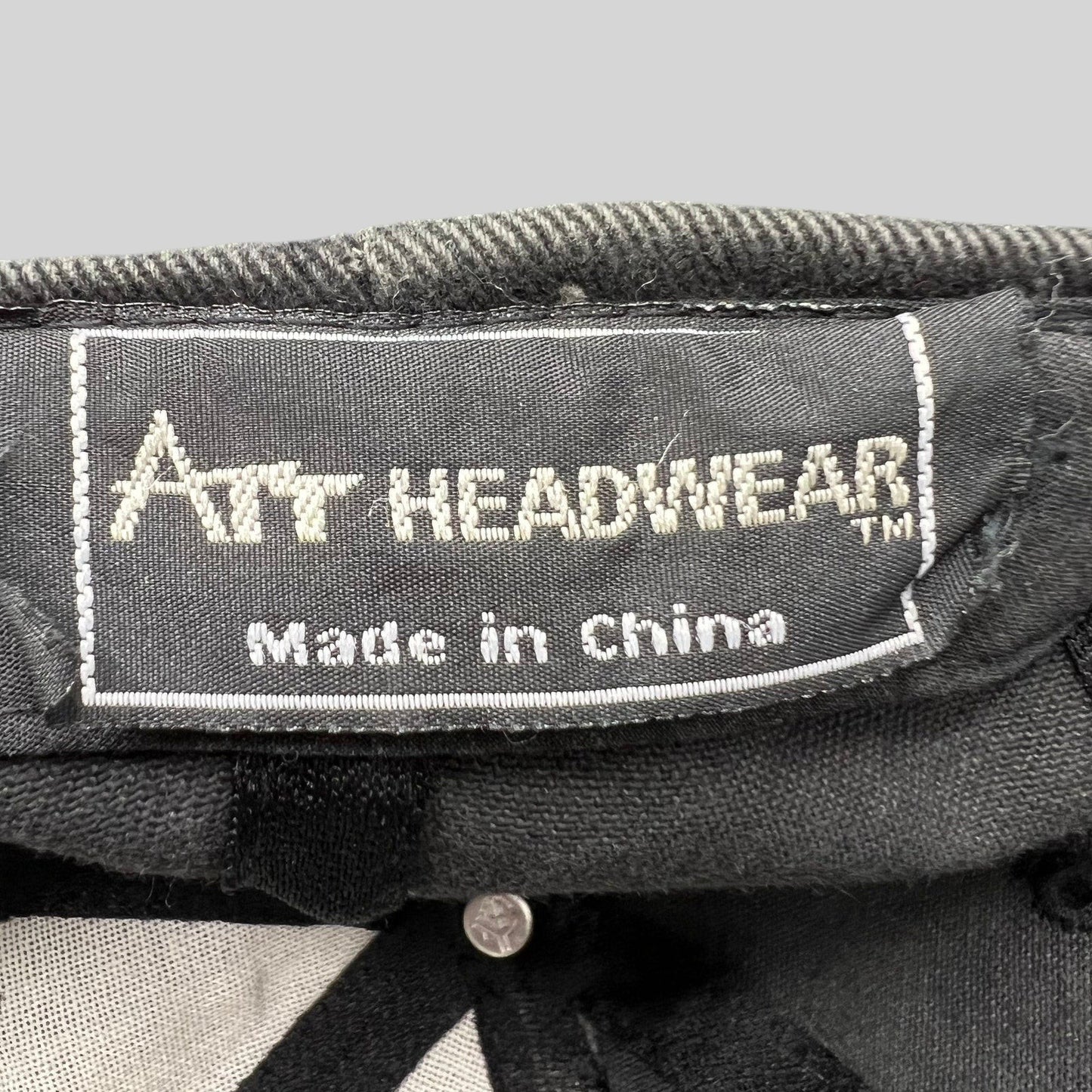 Raree Finds vintage Pokémon hat interior tag showing Att Headwear branding and Made in China label on black fabric