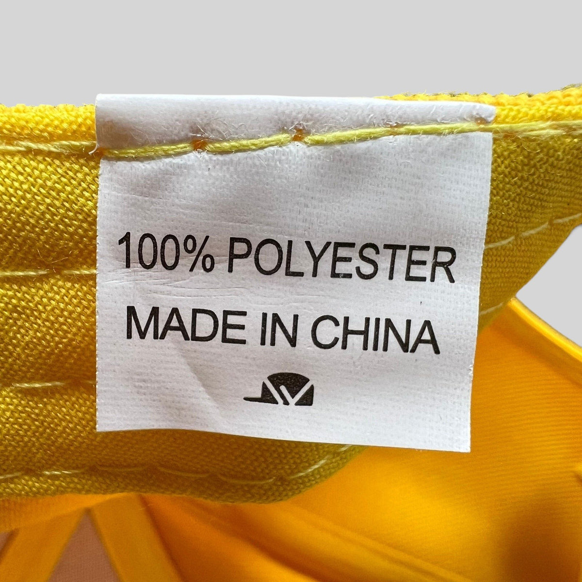 Raree Finds All American TV show crew hat interior tag showing 100 percent polyester material and made in China label