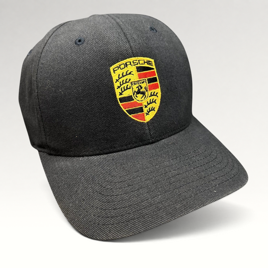 Raree Finds black Porsche Woodland Hills Flexfit cap with an embroidered Porsche crest logo on the front crown.