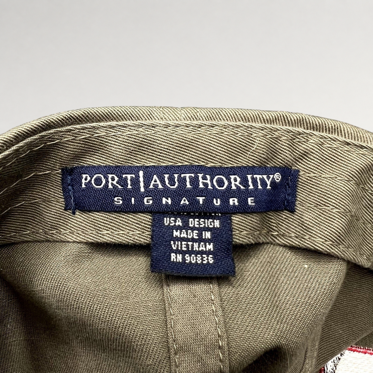 Raree Finds Port Authority Signature khaki cotton twill hat interior label with manufacturing details