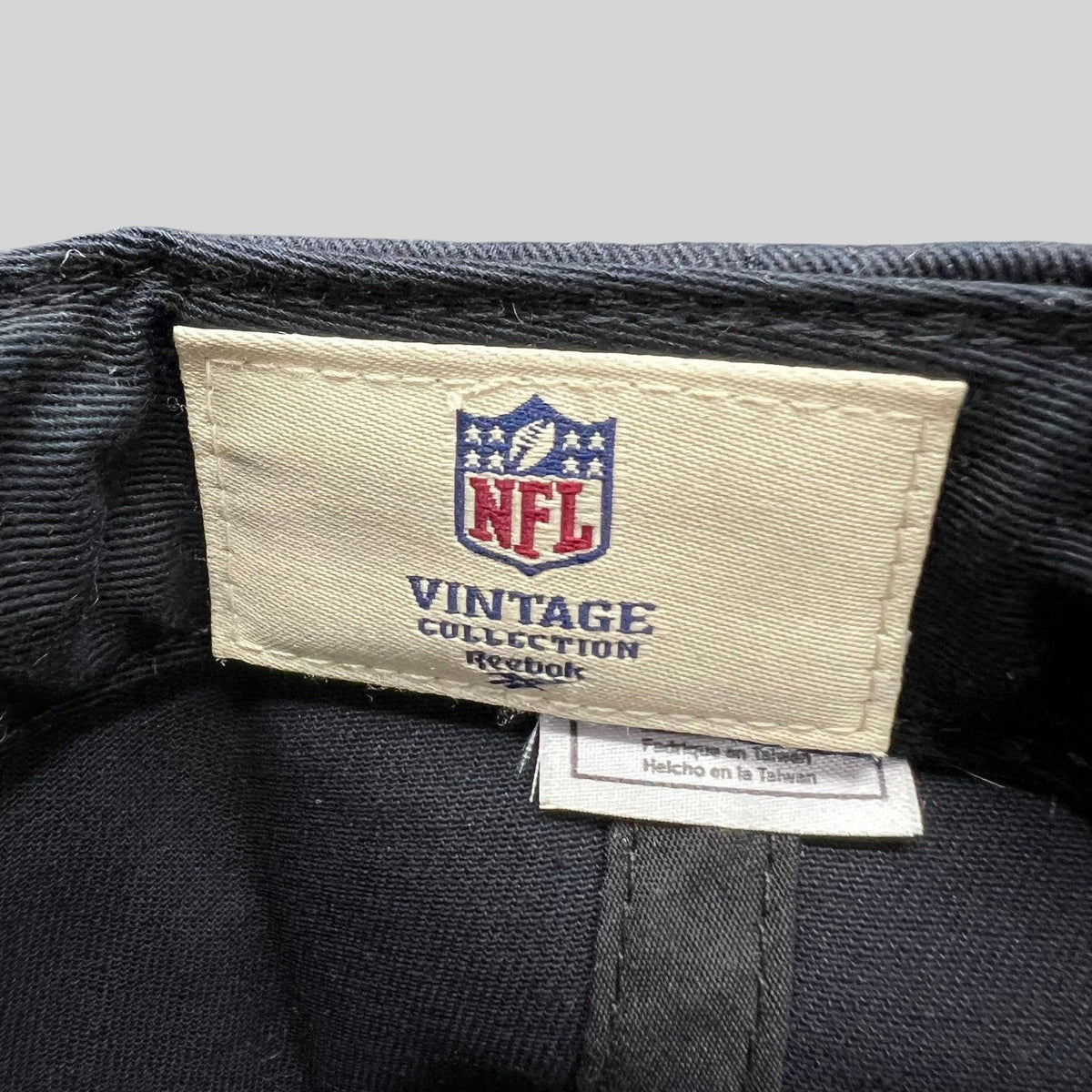 Raree Finds Reebok NFL Vintage Collection interior tag inside a black structured snapback hat