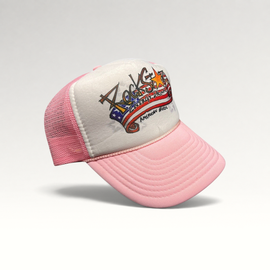 Raree Finds vintage Rockstar Energy Drink trucker hat with white foam front, pink mesh back, and American flag logo.