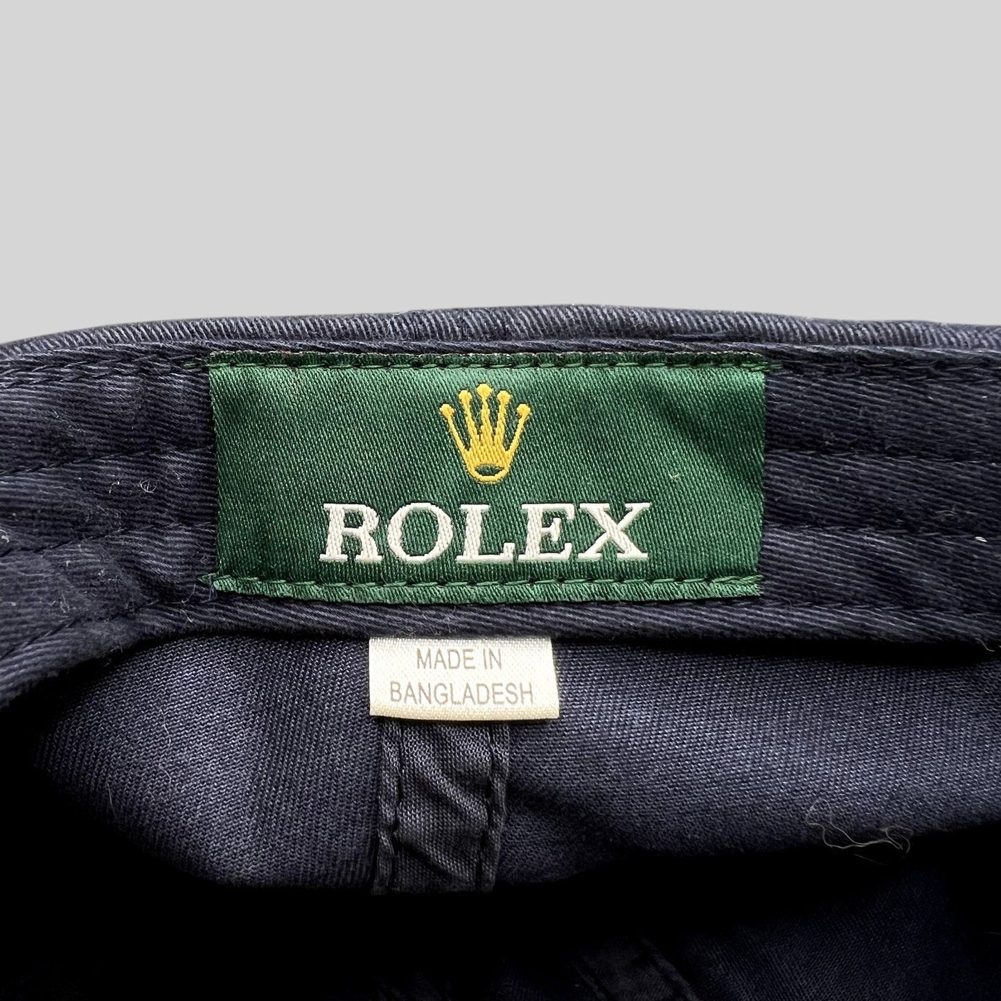 Raree Finds vintage navy blue sailing hat interior featuring a green Rolex brand tag and Made in Bangladesh label