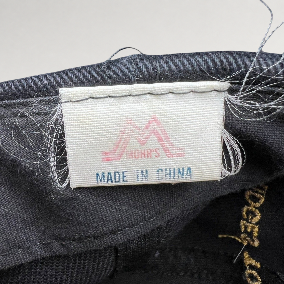Raree Finds vintage 1997 Rolling Stones tour hat interior label by Mohr's showing Made in China tag