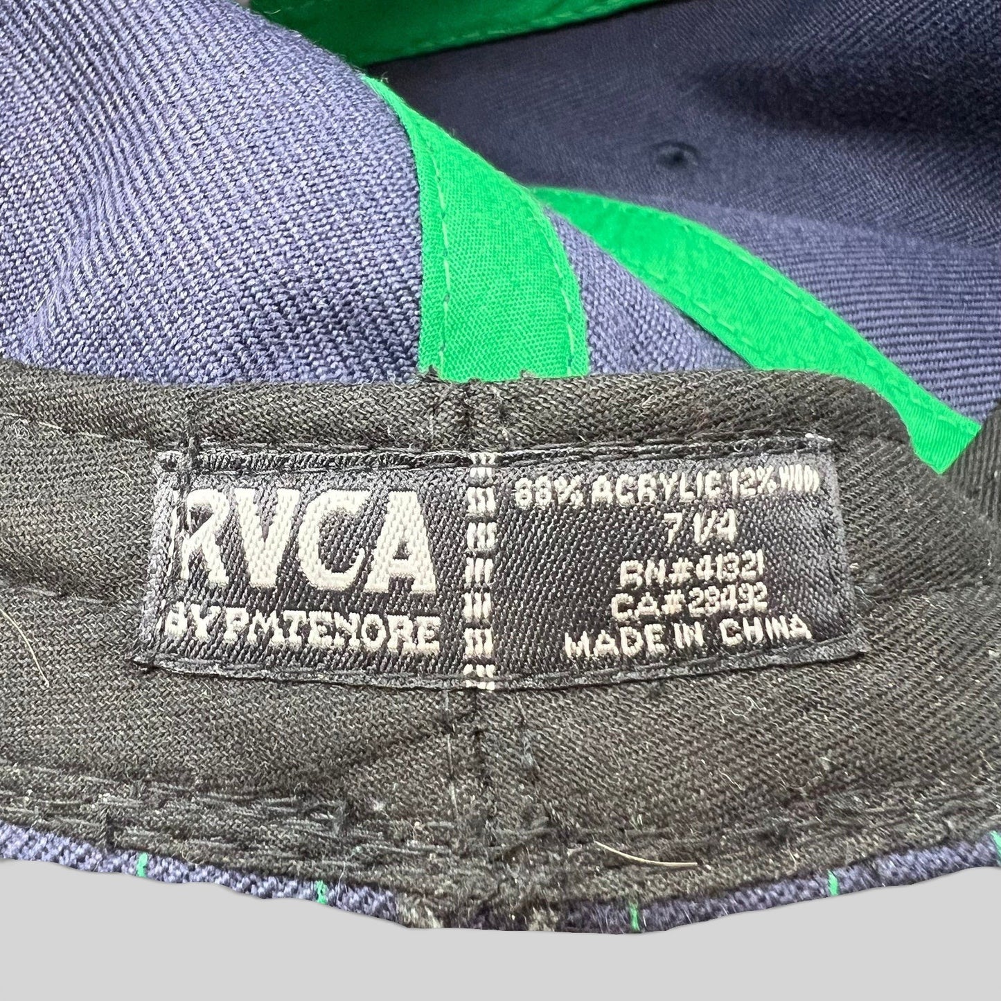 Raree Finds vintage RVCA by PM Tenore hat interior tag showing size 7 1/4 and acrylic wool blend material details