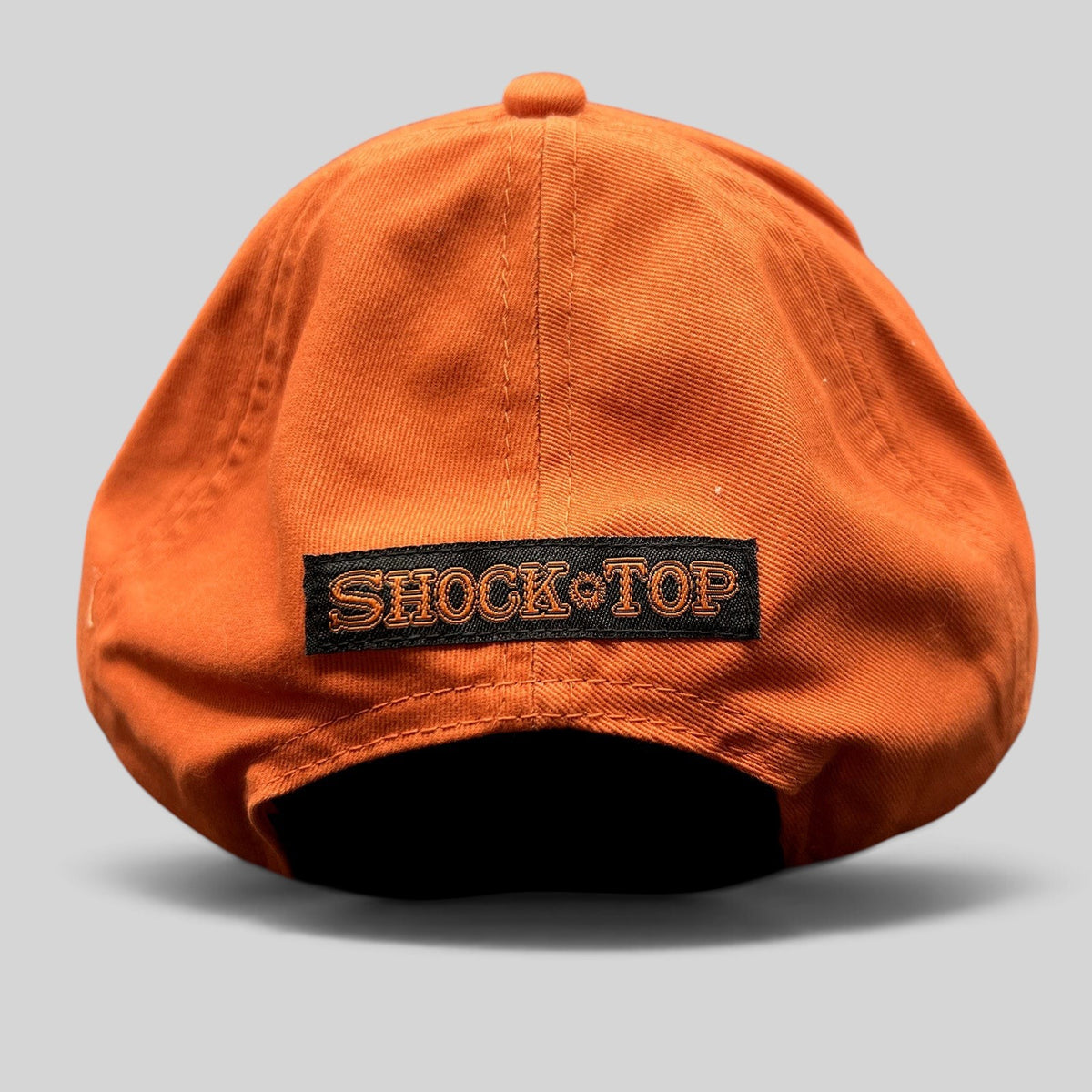 Raree Finds Shock Top orange cotton strapback hat with black rear logo embroidery and adjustable hook-and-loop strap