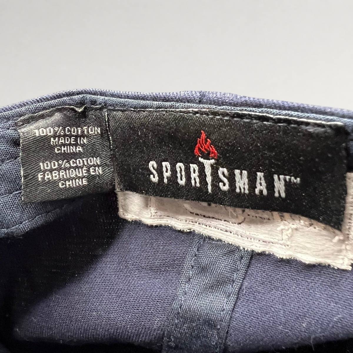 Raree Finds navy blue cotton Sportsman brand interior tag from a God Friended Me production strapback hat