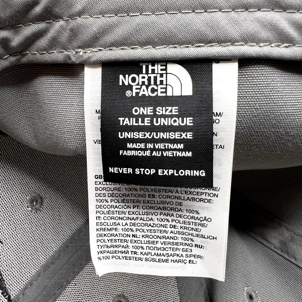 Raree Finds The North Face hat interior care label showing brand logo, size, and 100% polyester material details