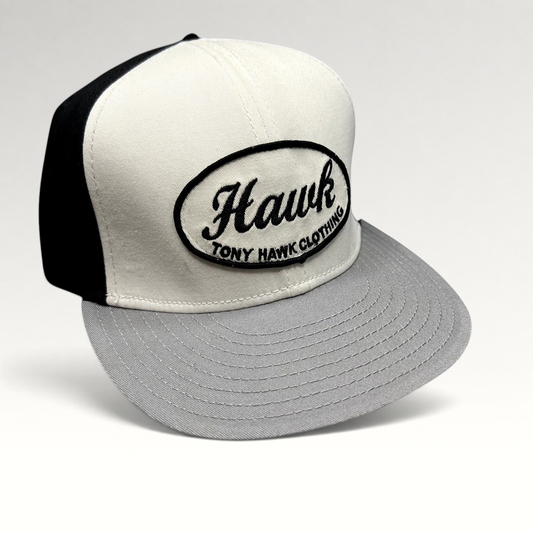 Raree Finds Tony Hawk Clothing strapback hat in black and white with an embroidered oval Hawk script logo patch.