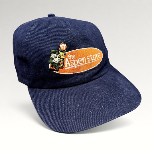 Raree Finds vintage 90s navy blue strapback hat with The Aspen Store embroidered mountain mascot logo and curved bill.