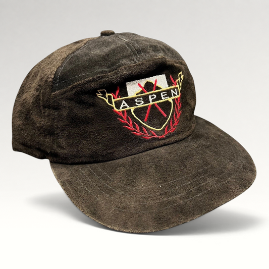 Raree Finds vintage black suede Aspen strapback hat with embroidered crest logo and leather strap closure.