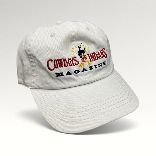 Raree Finds vintage white cotton strapback hat with Cowboys & Indians Magazine embroidered logo and bronc rider.