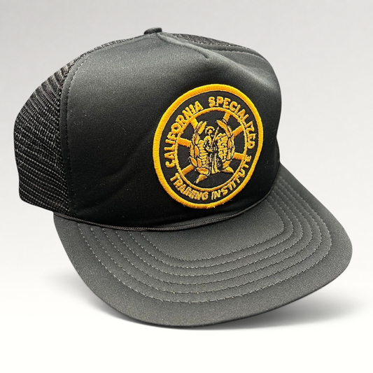 Raree Finds vintage black foam trucker hat with a gold California Specialized Training Institute embroidered patch.